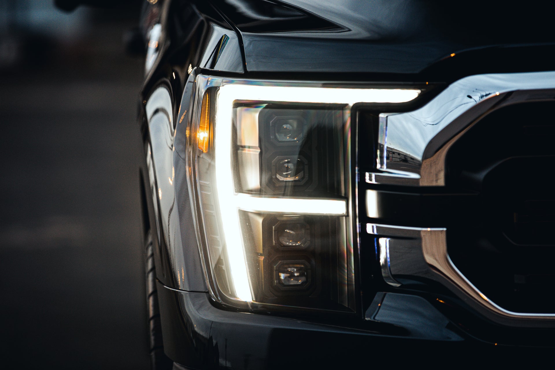 ANZO USA full LED projector headlight installed on a truck